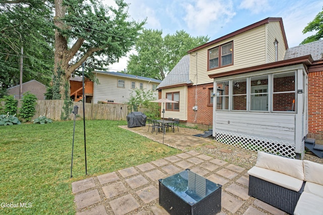 5 Kakely St, Albany, NY 12208 - rear view of property with a patio, an outdoor hangout area, and brick siding