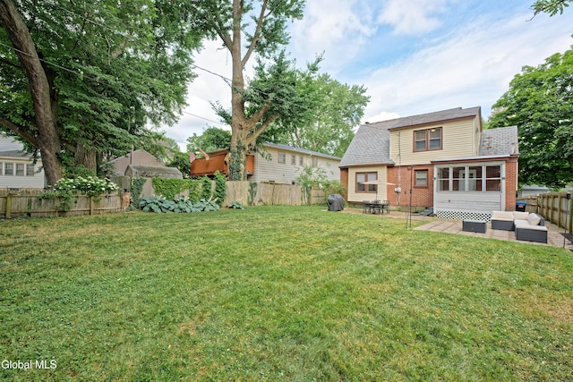 5 Kakely St, Albany, NY 12208 - rear view of house featuring an outdoor living space, brick siding, a patio, a fenced backyard, and roof with shingles