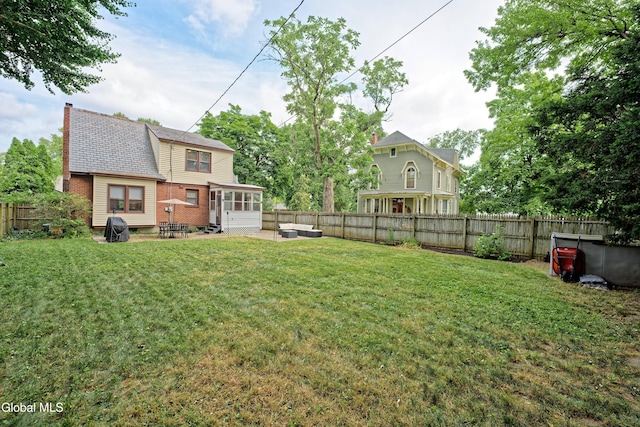 5 Kakely St, Albany, NY 12208 - fenced backyard featuring a sunroom and a patio area