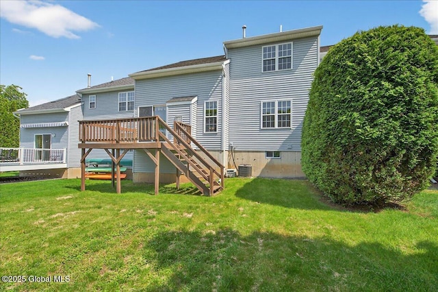 21 Fairway Dr Unit B, Mechanicville, NY 12118 - back of property with a wooden deck, stairs, a lawn, and central AC unit