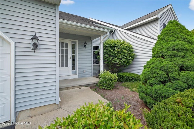 21 Fairway Dr Unit B, Mechanicville, NY 12118 - doorway to property with roof with shingles and covered porch
