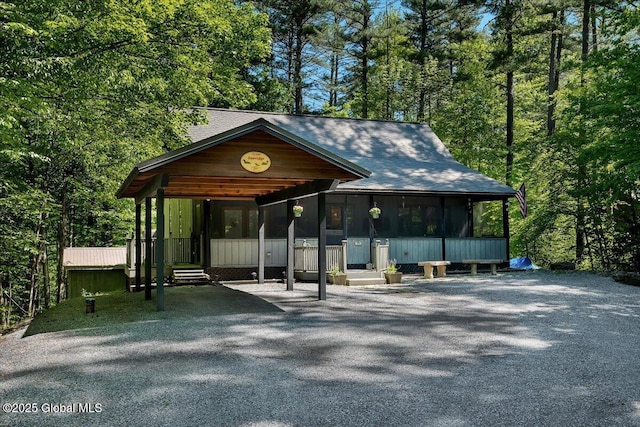 209 Chester Shores Rdg, Chester, NY 12817 - view of front facade featuring a sunroom and a carport