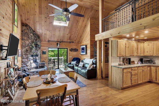 209 Chester Shores Rdg, Chester, NY 12817 - dining room featuring high vaulted ceiling, a ceiling fan, light wood-style flooring, wood walls, and wood ceiling