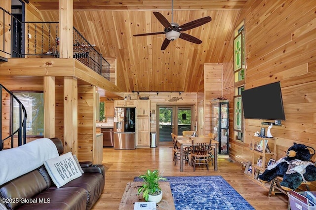209 Chester Shores Rdg, Chester, NY 12817 - living room featuring high vaulted ceiling, wooden walls, wooden ceiling, ceiling fan, and stairs
