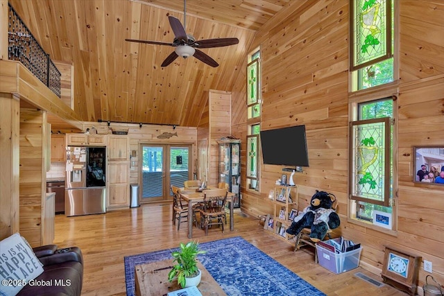 209 Chester Shores Rdg, Chester, NY 12817 - living room with high vaulted ceiling, wooden ceiling, wood walls, light wood finished floors, and a ceiling fan