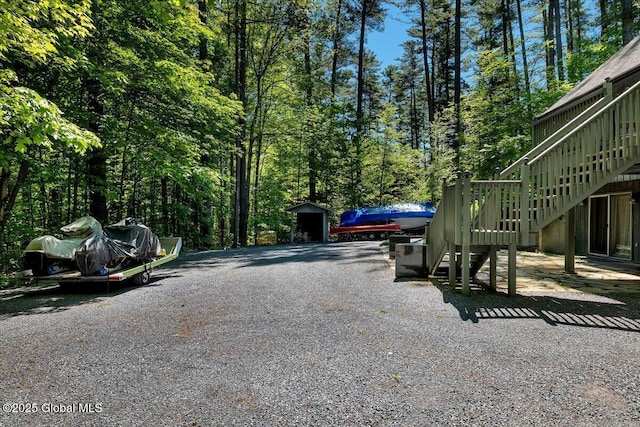 209 Chester Shores Rdg, Chester, NY 12817 - view of dirt / gravel driveway with stairway and a view of trees
