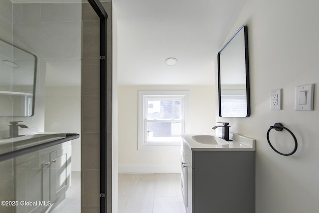 747 Eastern Ave, Schenectady, NY 12308 - full bathroom with vanity, baseboards, and a shower with door