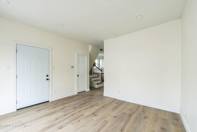 747 Eastern Ave, Schenectady, NY 12308 - entryway with light wood-style floors, stairs, and baseboards