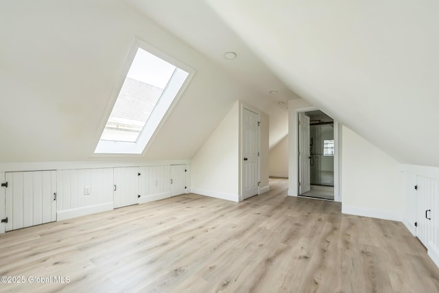 747 Eastern Ave, Schenectady, NY 12308 - additional living space featuring a skylight, light wood finished floors, vaulted ceiling, and baseboards