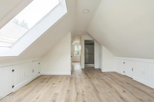 747 Eastern Ave, Schenectady, NY 12308 - additional living space featuring a skylight, lofted ceiling, light wood finished floors, and baseboards
