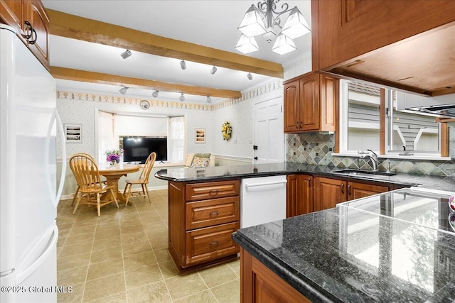 42 Pheasant Ridge Dr, Colonie, NY 12211 - kitchen with white appliances, a sink, brown cabinets, a peninsula, and wallpapered walls