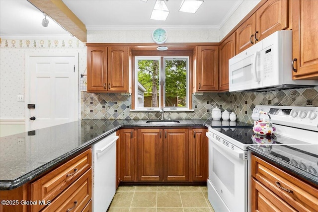 42 Pheasant Ridge Dr, Colonie, NY 12211 - kitchen with white appliances, a sink, dark stone counters, brown cabinets, and tasteful backsplash