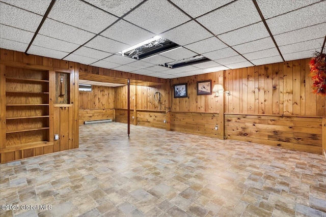 42 Pheasant Ridge Dr, Colonie, NY 12211 - finished below grade area with wood walls, stone finish flooring, a drop ceiling, and built in features