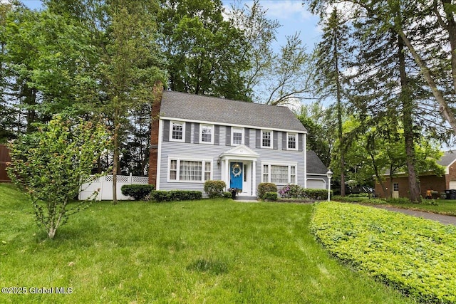 42 Pheasant Ridge Dr, Colonie, NY 12211 - colonial inspired home with a chimney, a shingled roof, and a garage