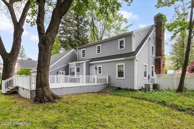 42 Pheasant Ridge Dr, Colonie, NY 12211 - rear view of property with a wooden deck, a chimney, roof with shingles, and cooling unit
