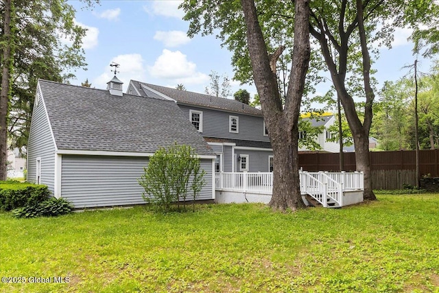42 Pheasant Ridge Dr, Colonie, NY 12211 - rear view of property with roof with shingles and a wooden deck