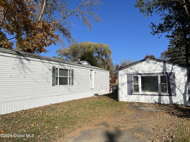 66 Plains Rd, Jackson, NY 12816 - view of home's exterior featuring a lawn