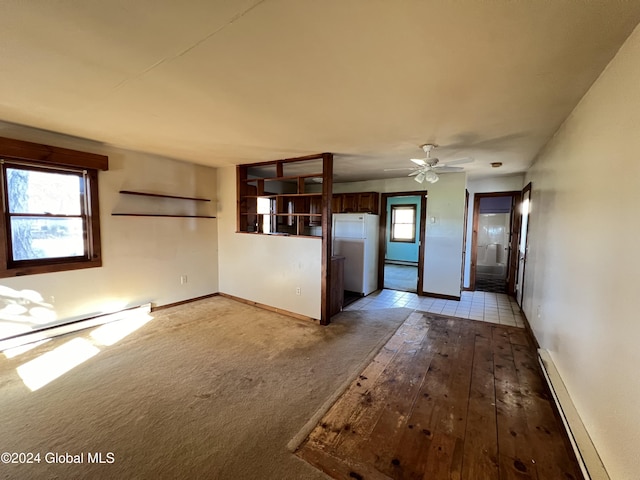 66 Plains Rd, Jackson, NY 12816 - unfurnished living room featuring a baseboard radiator, baseboard heating, and baseboards