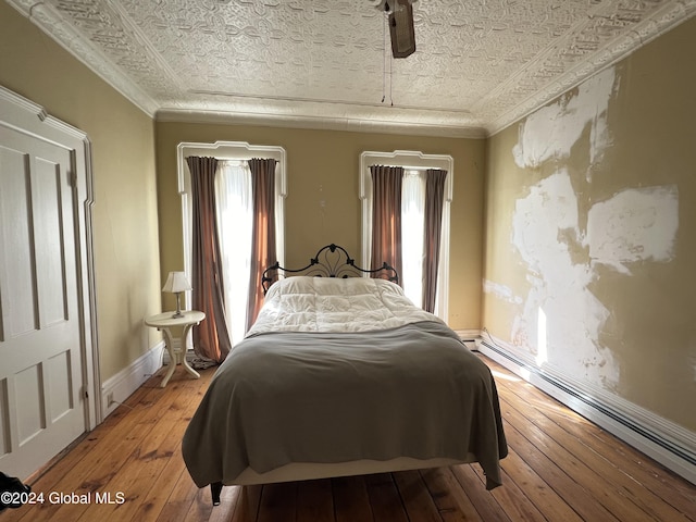 50 W Main St, Cambridge, NY 12816 - bedroom with an ornate ceiling, multiple windows, a baseboard radiator, light wood finished floors, and baseboards