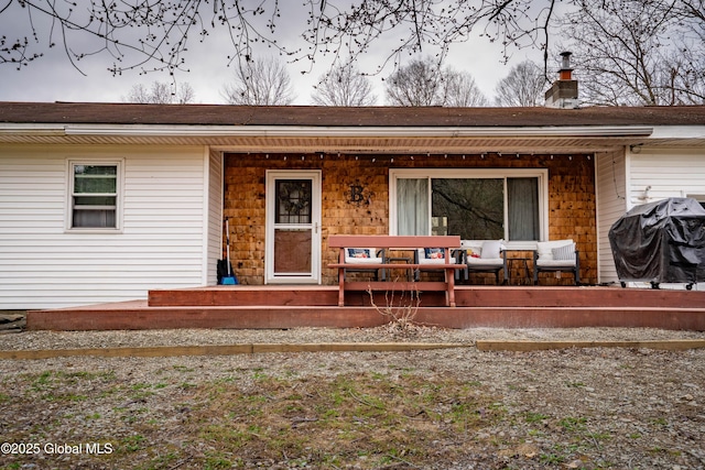 667-669 Ash Grove Rd, White Creek, NY 12816 - view of exterior entry with covered porch and a chimney