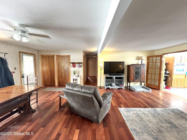 667-669 Ash Grove Rd, White Creek, NY 12816 - living area with wood finished floors, a ceiling fan, and wallpapered walls