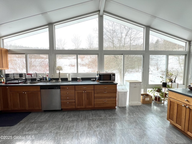 667-669 Ash Grove Rd, White Creek, NY 12816 - kitchen featuring stainless steel appliances, a sink, dark countertops, brown cabinetry, and lofted ceiling