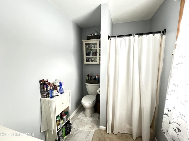 667-669 Ash Grove Rd, White Creek, NY 12816 - bathroom with toilet, baseboards, and a shower with shower curtain