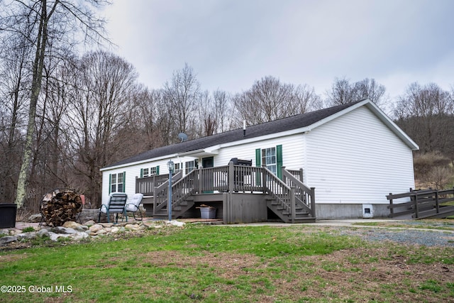 667-669 Ash Grove Rd, White Creek, NY 12816 - rear view of property with stairway, a wooden deck, a lawn, and roof with shingles