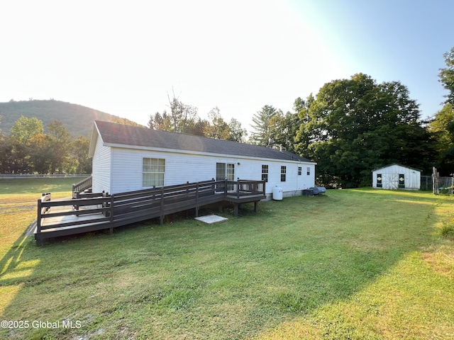 667-669 Ash Grove Rd, White Creek, NY 12816 - rear view of house featuring a deck and a lawn