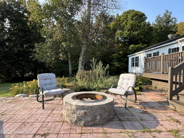 667-669 Ash Grove Rd, White Creek, NY 12816 - view of patio / terrace with an outdoor fire pit and a deck
