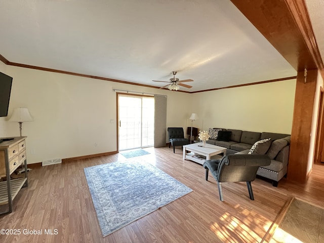 667-669 Ash Grove Rd, White Creek, NY 12816 - living area featuring ceiling fan, wood finished floors, baseboards, and crown molding