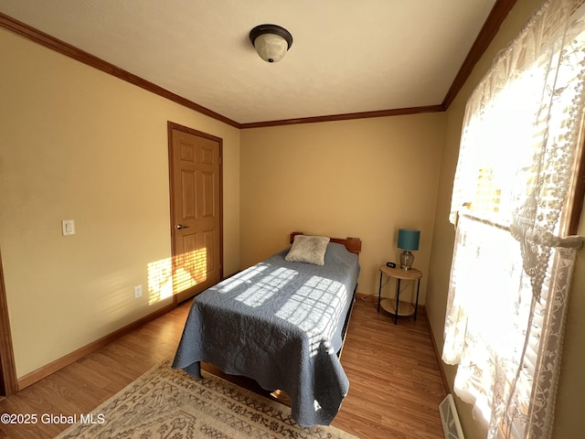 667-669 Ash Grove Rd, White Creek, NY 12816 - bedroom with wood finished floors, crown molding, and baseboards