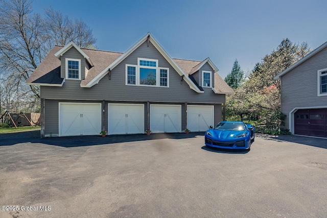 7 Western Ave, Charlton, NY 12019 - garage featuring asphalt driveway