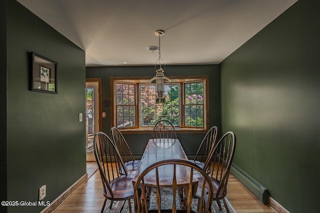 7 Western Ave, Charlton, NY 12019 - dining space with a baseboard radiator, baseboards, and wood finished floors