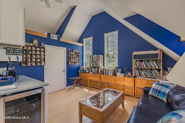 7 Western Ave, Charlton, NY 12019 - living area with beverage cooler, light wood-type flooring, vaulted ceiling, and a ceiling fan