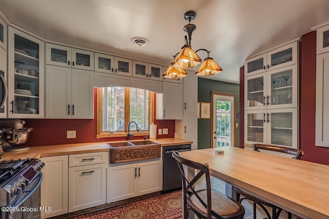 7 Western Ave, Charlton, NY 12019 - kitchen featuring black dishwasher, a sink, wooden counters, stainless steel range with gas cooktop, and decorative light fixtures