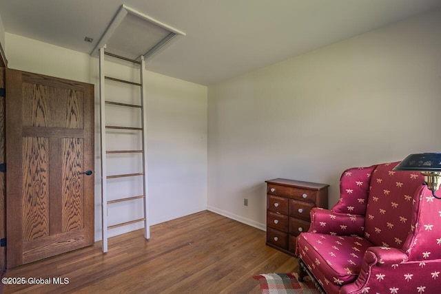 7 Western Ave, Charlton, NY 12019 - sitting room with wood finished floors, attic access, and baseboards