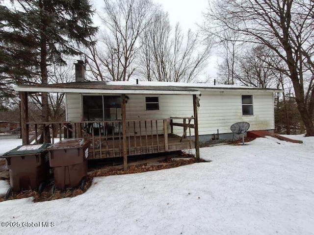 2459 Delaware Tpke, New Scotland, NY 12186 - snow covered house featuring a wooden deck and a chimney