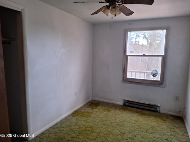 2459 Delaware Tpke, New Scotland, NY 12186 - unfurnished bedroom with baseboard heating, carpet, baseboards, and ceiling fan