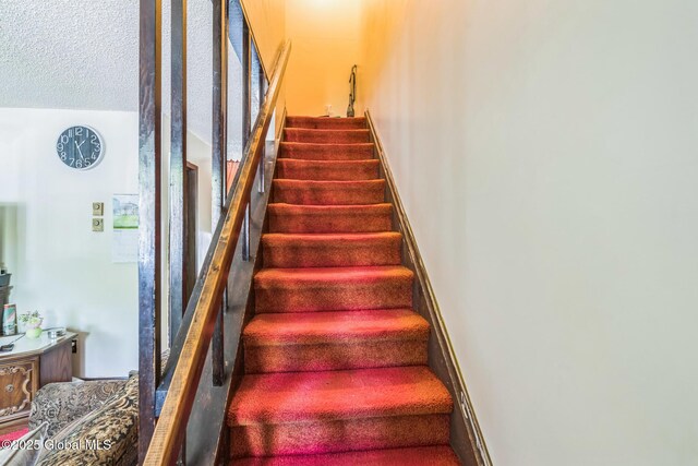 27 Columbia St, Hudson, NY 12534 - staircase with a textured ceiling