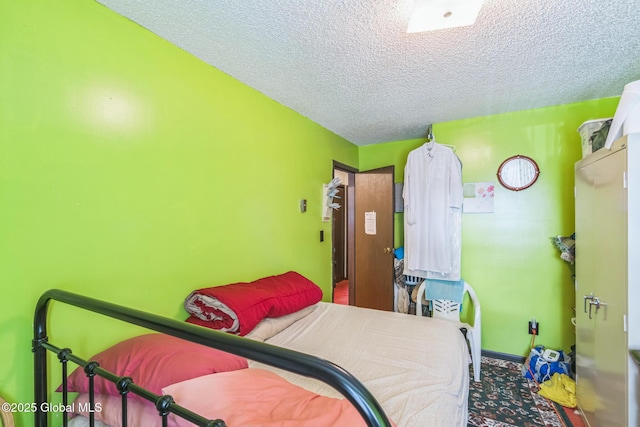 27 Columbia St, Hudson, NY 12534 - bedroom featuring a textured ceiling, baseboards, and carpet