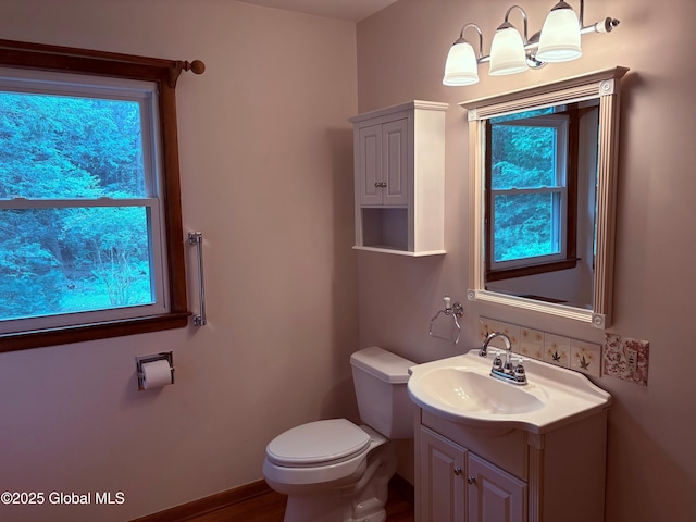 8 Lee Ave, Rexford, NY 12148 - bathroom with vanity, toilet, and baseboards