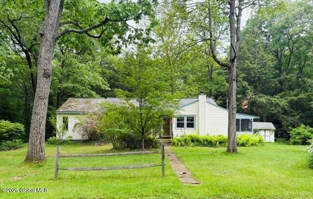 8 Lee Ave, Rexford, NY 12148 - view of front of house featuring a front yard and a chimney