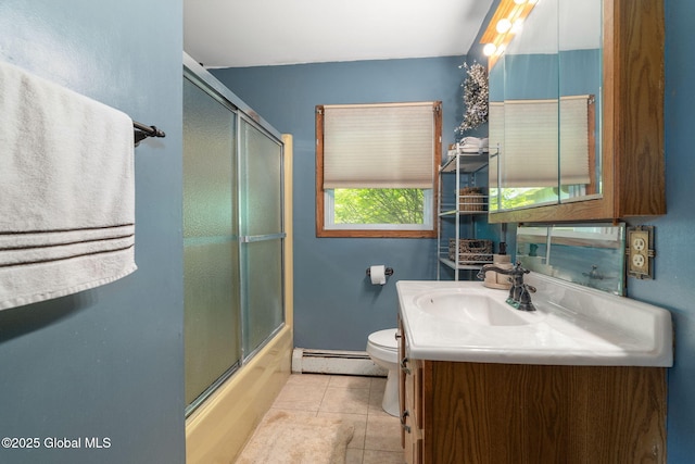 2 Pheasant Ln, East Greenbush, NY 12061 - full bathroom with baseboard heating, vanity, toilet, tile patterned flooring, and enclosed tub / shower combo
