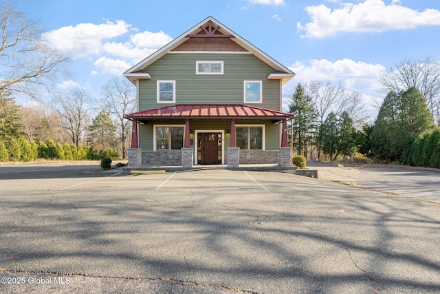 658 Saratoga Rd, Glenville, NY 12302 - view of front of property featuring stone siding, a porch, and uncovered parking