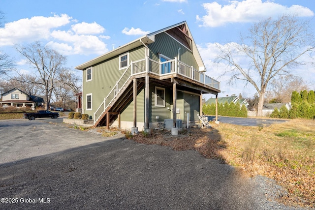 658 Saratoga Rd, Glenville, NY 12302 - rear view of house with stairs, a deck, and asphalt driveway