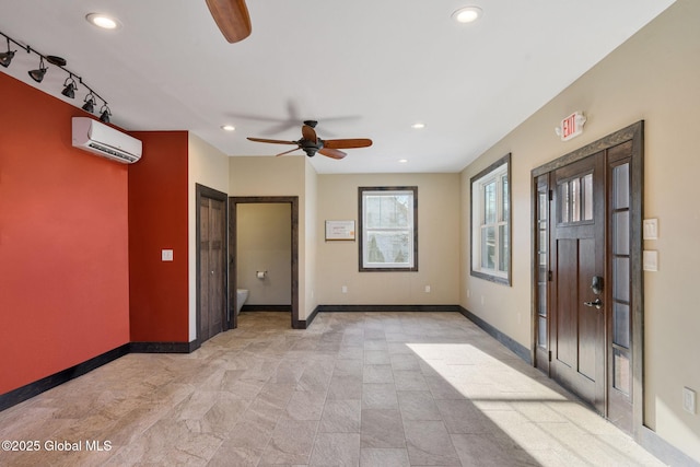 658 Saratoga Rd, Glenville, NY 12302 - entrance foyer featuring ceiling fan, a wall mounted air conditioner, baseboards, recessed lighting, and rail lighting