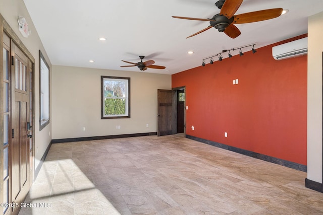 658 Saratoga Rd, Glenville, NY 12302 - empty room with a wall unit AC, a ceiling fan, rail lighting, recessed lighting, and baseboards