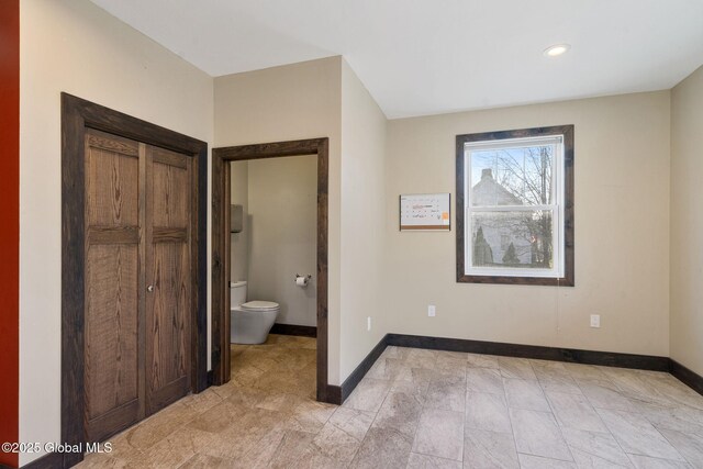 658 Saratoga Rd, Glenville, NY 12302 - unfurnished bedroom featuring baseboards, recessed lighting, and ensuite bathroom