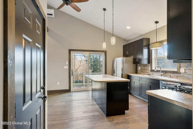 658 Saratoga Rd, Glenville, NY 12302 - kitchen with a sink, a kitchen island, a ceiling fan, light countertops, and recessed lighting
